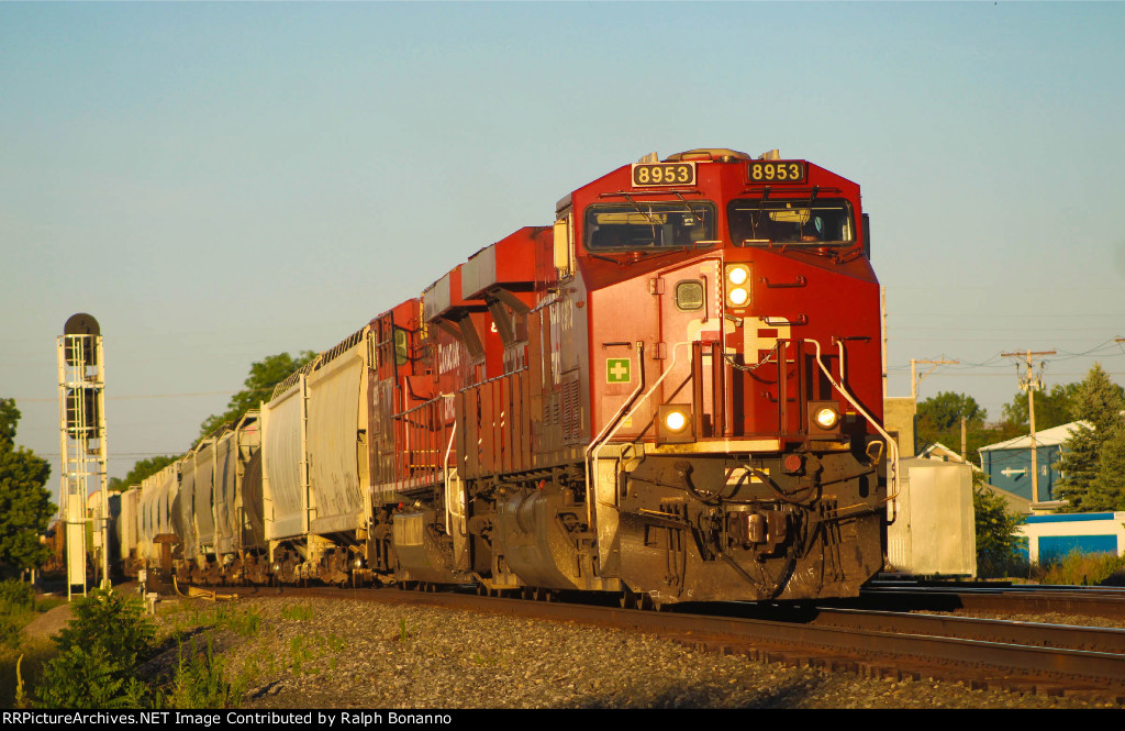 Westbound CP 131 passing the Amtrak station in town 
